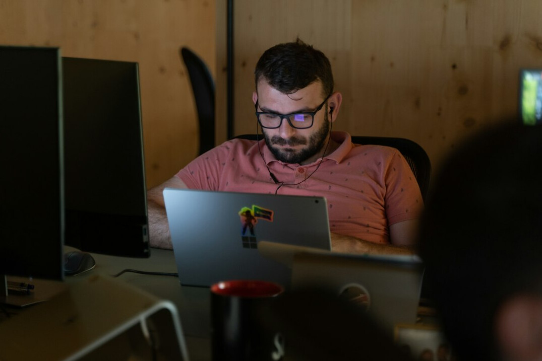 programmer working on laptop