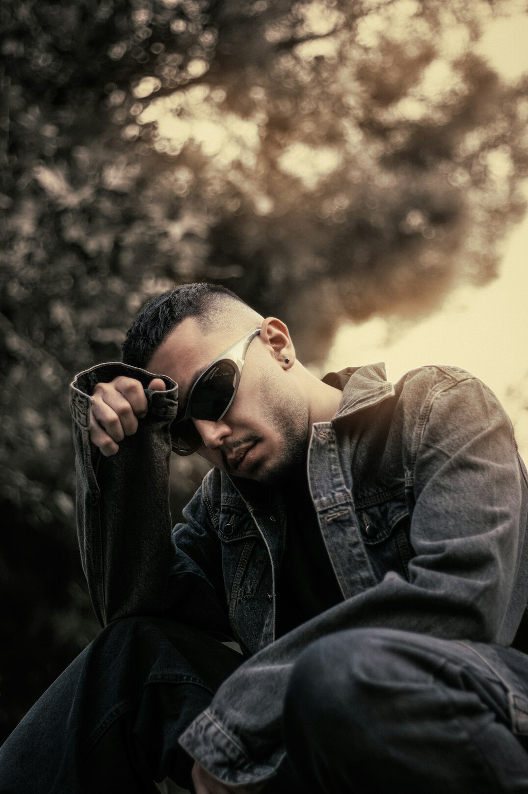 Studio portrait of a Malay man wearing glasses
