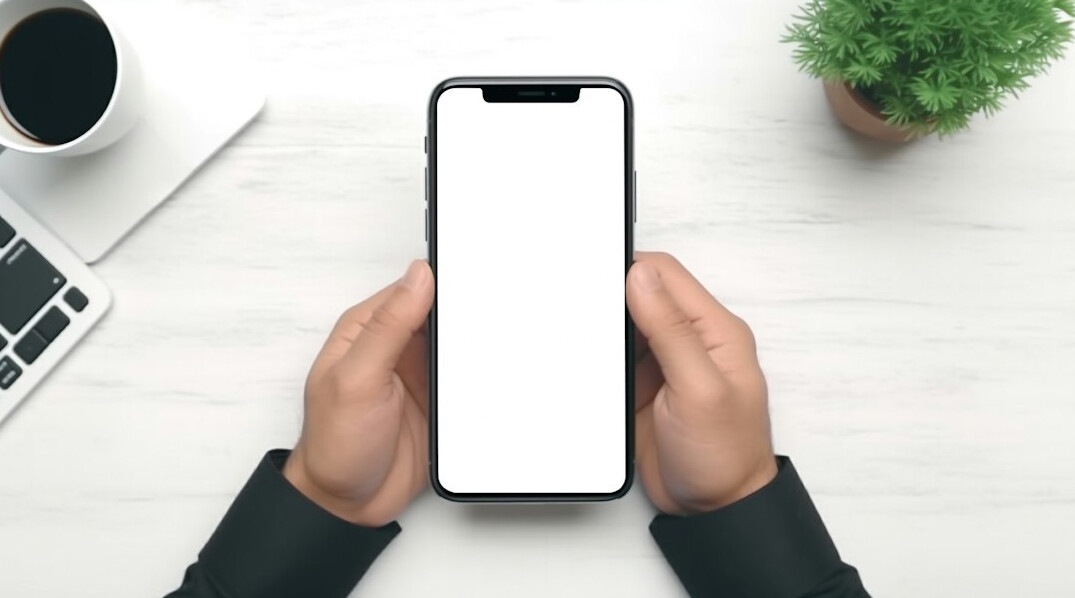 Hands holding a smartphone showing a digital claims processing app